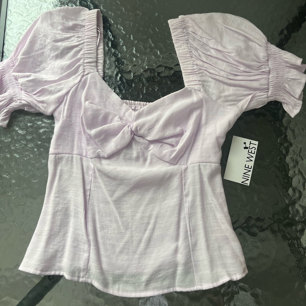 Woman’s Nine West twist front puff sleeve top